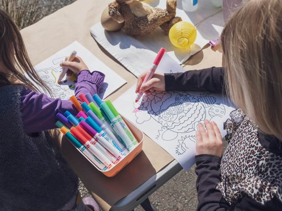 Children coloring with markers